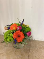 Low and Lush Floral  Moundy style arrangement with our weekly product