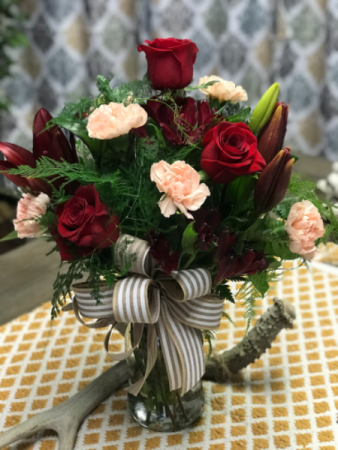 Luscious blooms Mixed roses with carnation and alstroemerias in red and peach