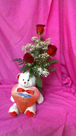 RV3V Luv Ya !!!! Bud vase of 3 red roses and baby breath along with stuffed teddy bear holding valentines day chocolates