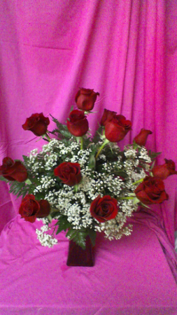 R12RD Mad About Red Dozen Long Stem Roses in a red vase