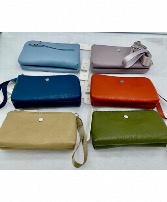 Medium size purse Canadian Owned  With cross body strap included assorted colours 