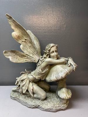 mischievous fairy statue