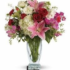 A 9 Mixed Flowers In A Tall Vase Flowers And Colors May Vary In