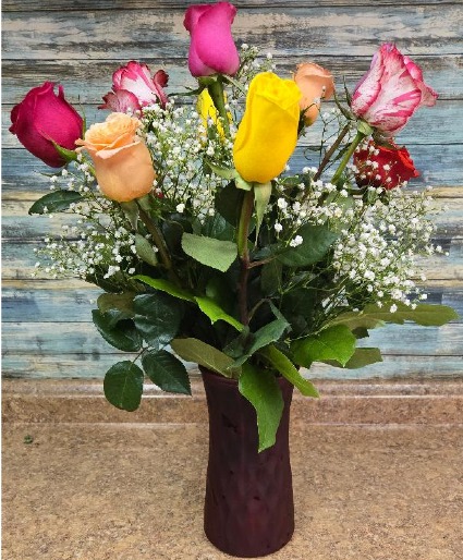 Mixed roses in red vase Roses