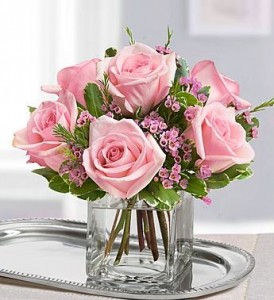  CUBE VASE WITH 6 PINK ROSES WITH FILLER!  Wax flower if in season or baby's breath. ( roses vary in light to dark pink weekly)