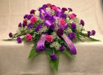 LAVENDER TRIBUTE  Half Casket Spray of of dark and light purple carnations and ribbon and baby's breath
