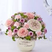 Mothers Love is a Treasure mixed arrangement of Roses, Carnations and Buttons
