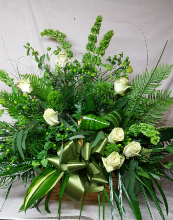 Natures Verde Sympathy Basket wicker basket for sympathy of a lush foliage and green rose to pop the greens
