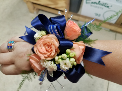 navy and orange corsage