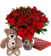 HAPPY VALENTINE'S DAY BOUQUET..ALL.RED   ASSORTED SEASONAL FLOWERS ARRANGED IN A VASE...also included in the price is A MEDIUM BEAR AND BOX OF CHOCOLATES!    