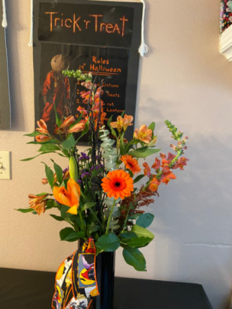 October dreams Fall mixed vase arrangement with bat and ribbon