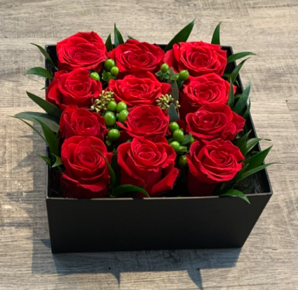 One dozen Red Roses Boxed with Lid and Bow Included
