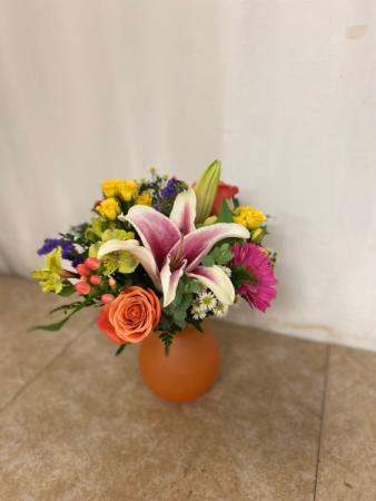 Orange Delight Bright arrangement filled with long lasting florals in Winter Park, FL | APPLEBLOSSOM FLORIST & GIFTS