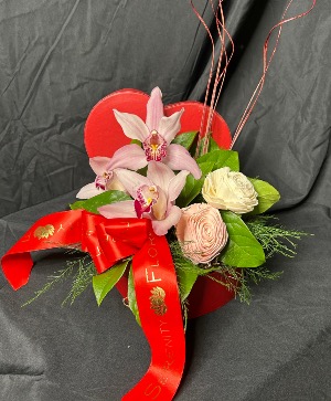 Orchid blooms  Heart shaped box with orchids and dried flowers 