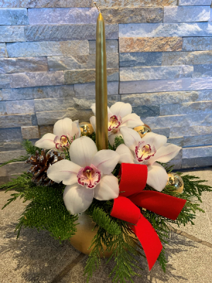 Orchids' Centrepice with a candle Color of orchids may vary