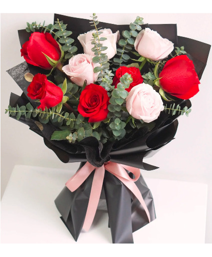 Passionately red and pink rose   wrapped bouquet 