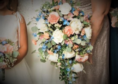 Peaches and blue cascading bouquet