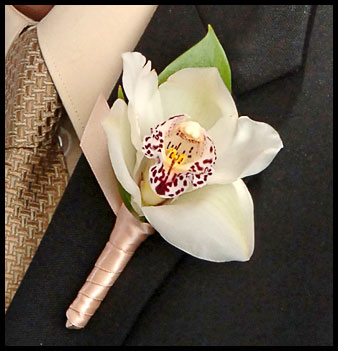 perfect orchid  boutonniere