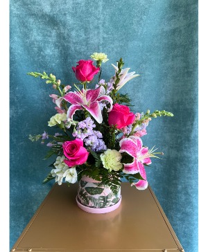 PETALS AND A PLANTER FLOWER ARRANGEMENT