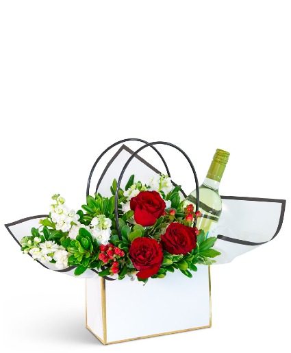 Petals and A Pour Tote with White Wine Flower Arrangement