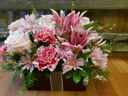 Pink and Lavender gift pastel lilies, roses, daisies and carns in a bamboo box