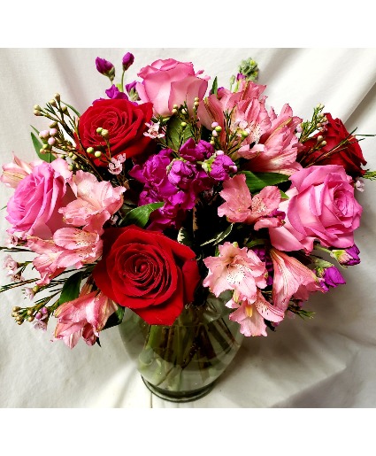 PINK AND RED DELIGHT...RED AND PINK ROSES ARRANGED In a vase with pink flowers (pink flowers may vary depending on stock)