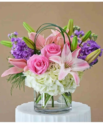 Pink and white Floral design in Glass vase  