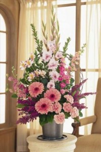 https://cdn.atwilltech.com/flowerdatabase/p/pink-floor-basket-sympathy-5967b5c74438a.300.jpg