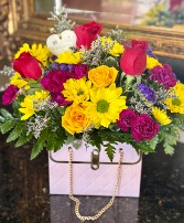 Pink purse floral arrangement 