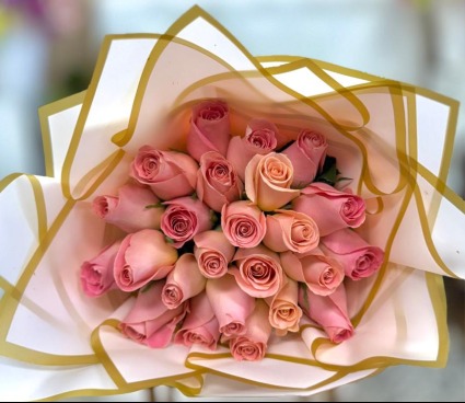 Wrapped Pink roses in pink paper  