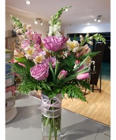 CARING WISPERS A mix of pastel colours in a vase