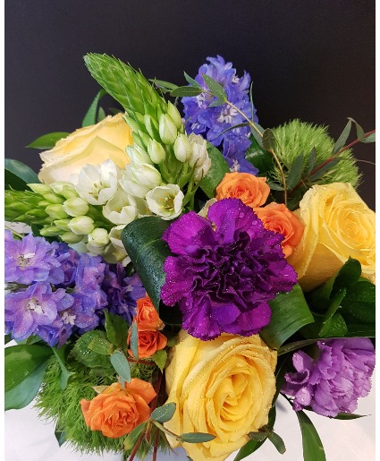 PLEASANTLY DELIGHTFUL Yellows, orange and purple hand tied bouquet