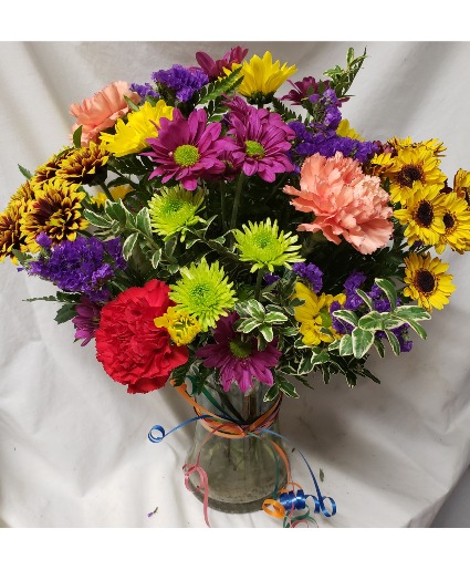 POP OF COLOR...ALL AROUND BOKA OF SEASONAL Daisies and carnations and filler(colors could vary with seasons)