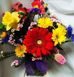 Bright spring flowers arranged in a rectangular  vase!