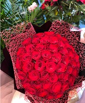 PREMIUM 50 long stem rose count wrapped  roses