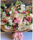 Premium Pink wrapped bouquet  Assortment of seasonal florals with pink