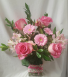"PRETTY IN PINK" ALL FLOWERS ARE PINK. SOME  flowers may vary depending on stock. ARRANGED in a cute ribbon rectangular vase!