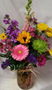 PRETTY PLEASE Bouquet...seasonal bright flowers In a mason jar. Mason Jar  colors may vary.