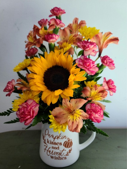 Pumpkin kisses and harvest wishes Mug arrangement 