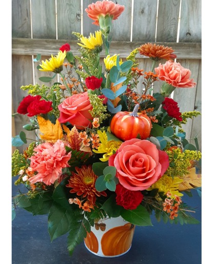 Pumpkin patch  fall arrangement with a pumpkin and a couple of roses