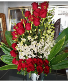 Pure Elegance $550 Lovely Red Roses and Orchid Arrangement