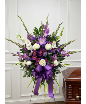 Purple and white funeral arrangement 