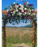 Purple and White Wedding Arbor Ceremony Flowers