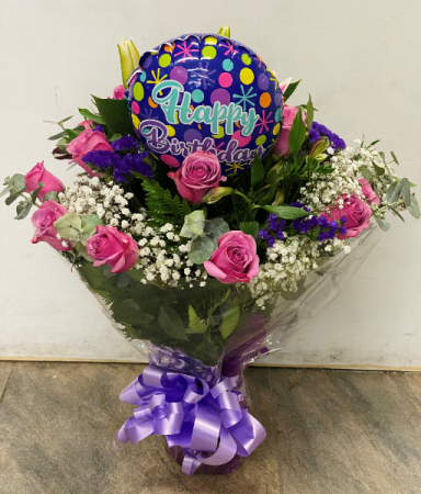 Purple roses in a vase Birthday