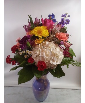 Purple Vase Arrangement Mixed Arrangement w/several different flower types