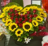 R19: Arrangement with 18 roses and 16 sunflowers 