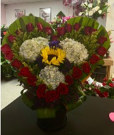 R23: Arrangement with 24 red roses and mix flowers  in Mcallen, Texas | Rodriguez Wholesale Flowers