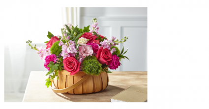 RADIANCE IN BLOOM BASKET PINK AND GREEN FLOWERS IN BASKET