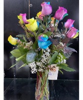 Rainbow Roses One Dozen Long Stems  Arranged in A Slim Rose Vase With A Bow