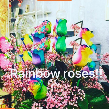 Rainbow roses Vase arrangement with rainbow roses.